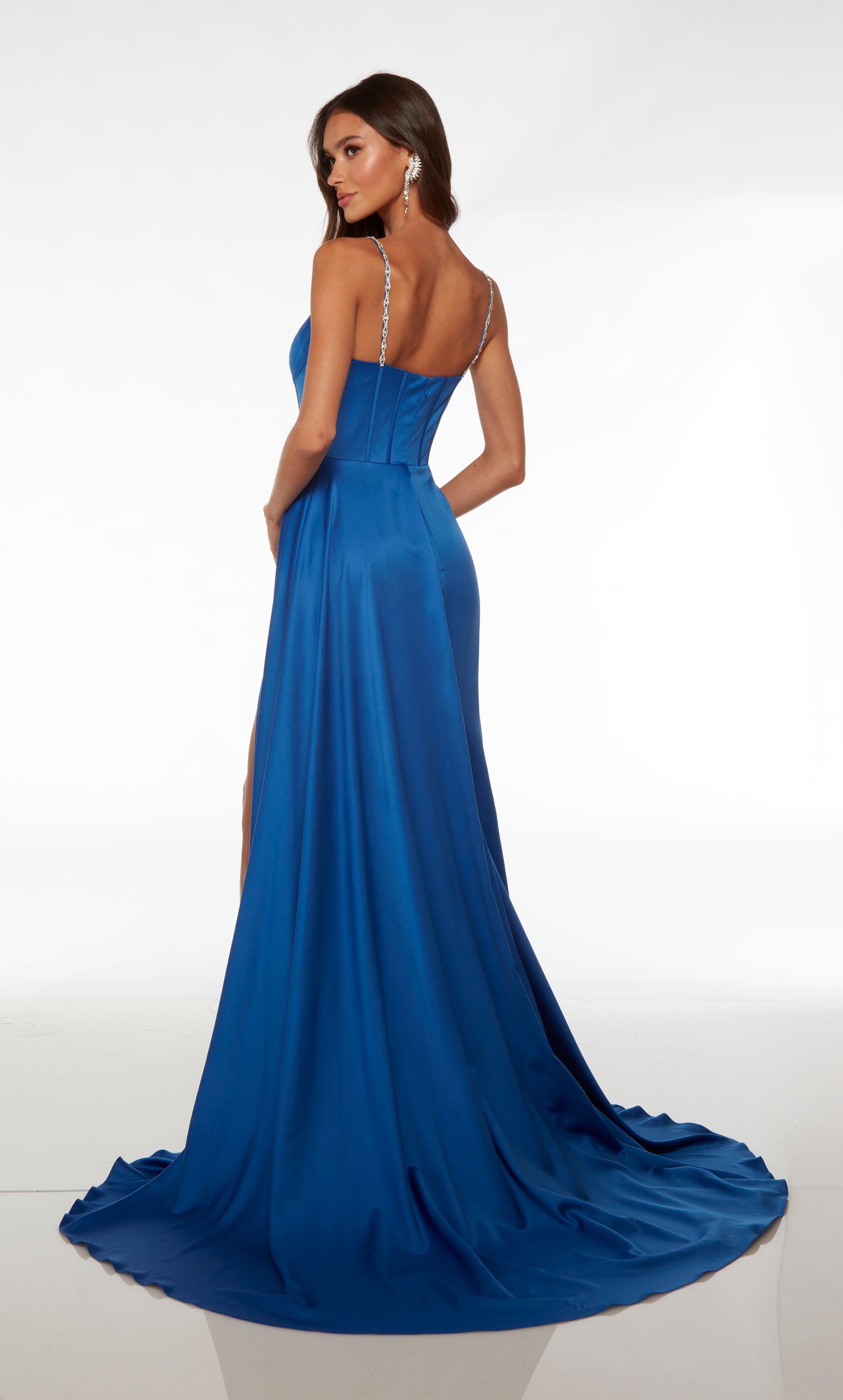 Designer blue satin dress with an modified sweetheart neckline, jeweled straps, corset bodice, high slit, train, and side train for an dramatic and stylish effect.