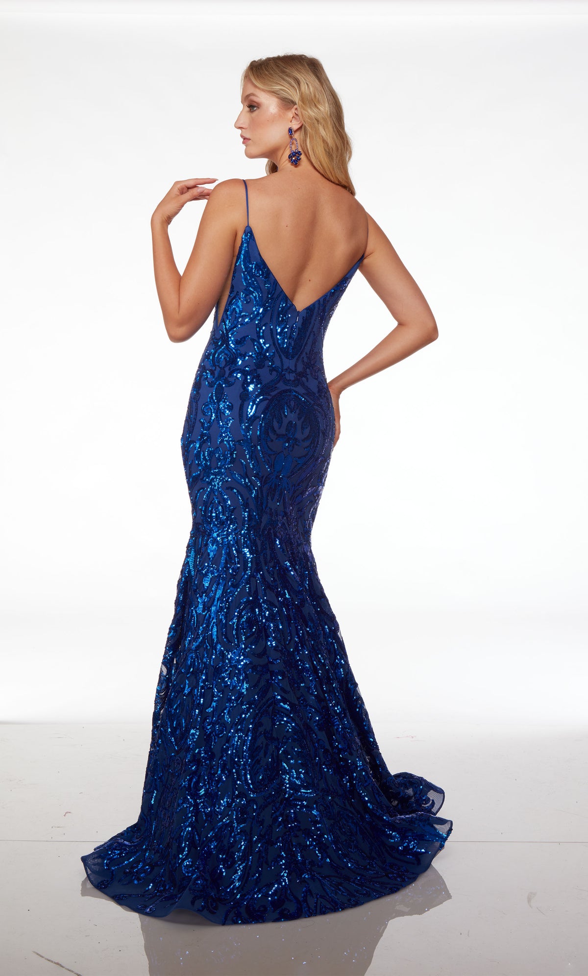 Elegant royal blue sparkly mermaid prom dress: plunging neckline, illusion cutouts, V-shaped open back—an dazzling and sophisticated ensemble.