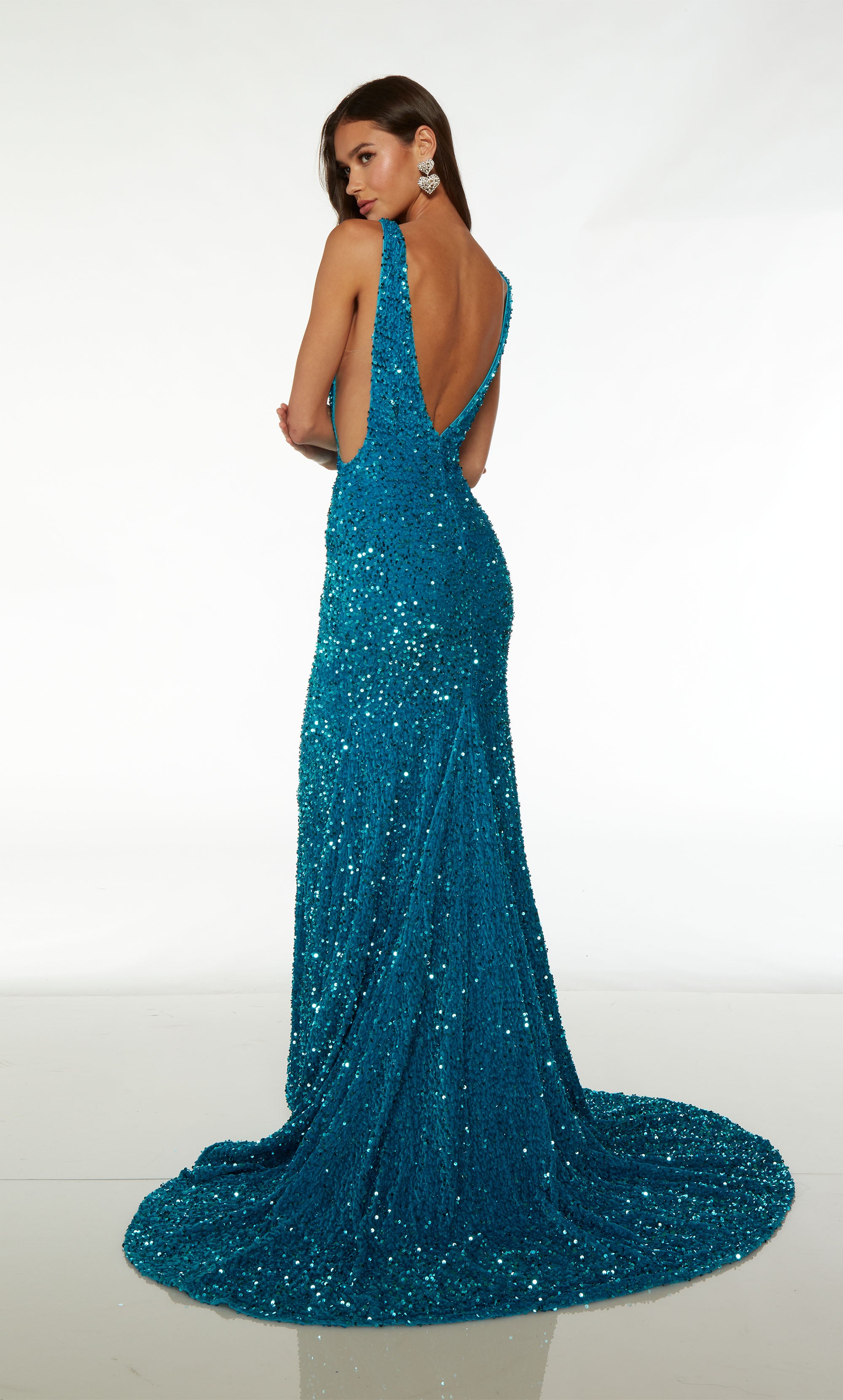 Gorgeous fit-and-flare designer dress in ocean blue plush sequins: plunging neckline, illusion side cutouts, V-shaped open back, and train.