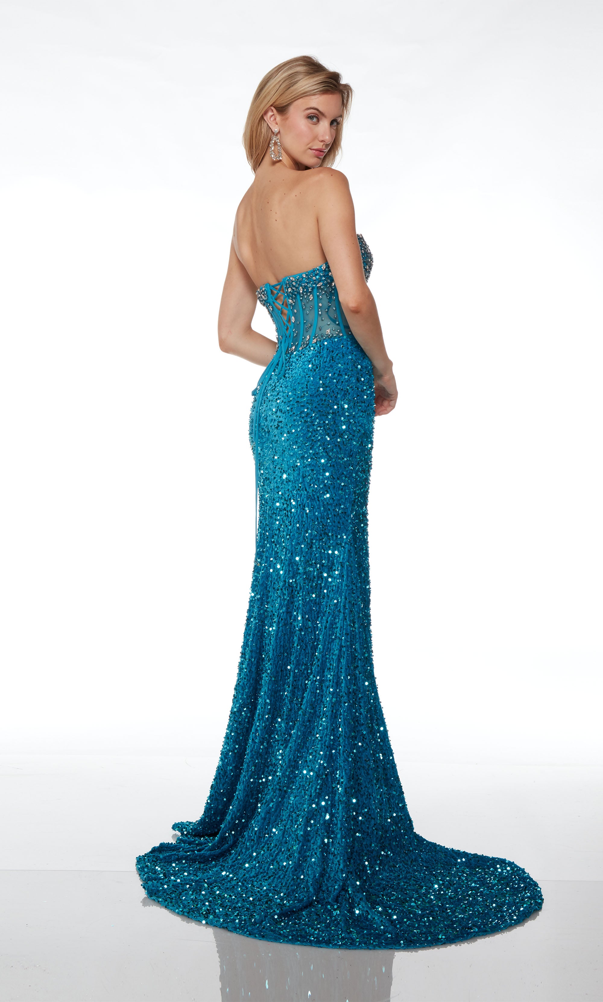 Fully embellished ocean blue prom dress: strapless sheer corset bodice, high slit, lace-up back, and train for an glamorous and stylish look.