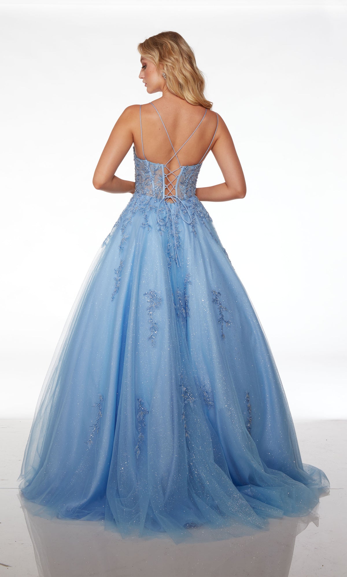 Cinderella-esque light blue glitter tulle ball gown: V neckline, sheer corset bodice, dual spaghetti straps, lace-up back, and beaded floral lace appliques.