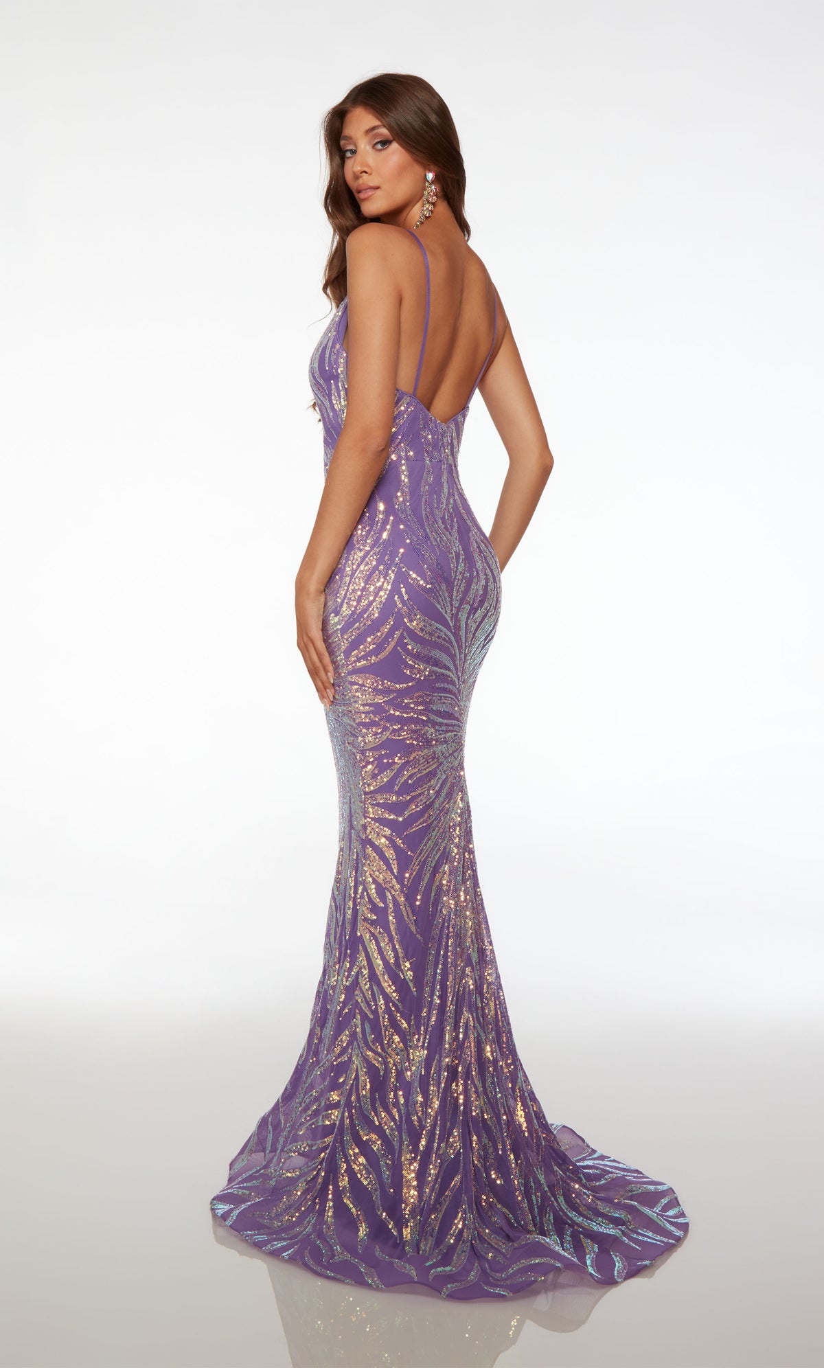Purple fit-and-flare prom dress with plunging V neckline, spaghetti straps, zip-up back, slight train, and captivating sequin detailing throughout.