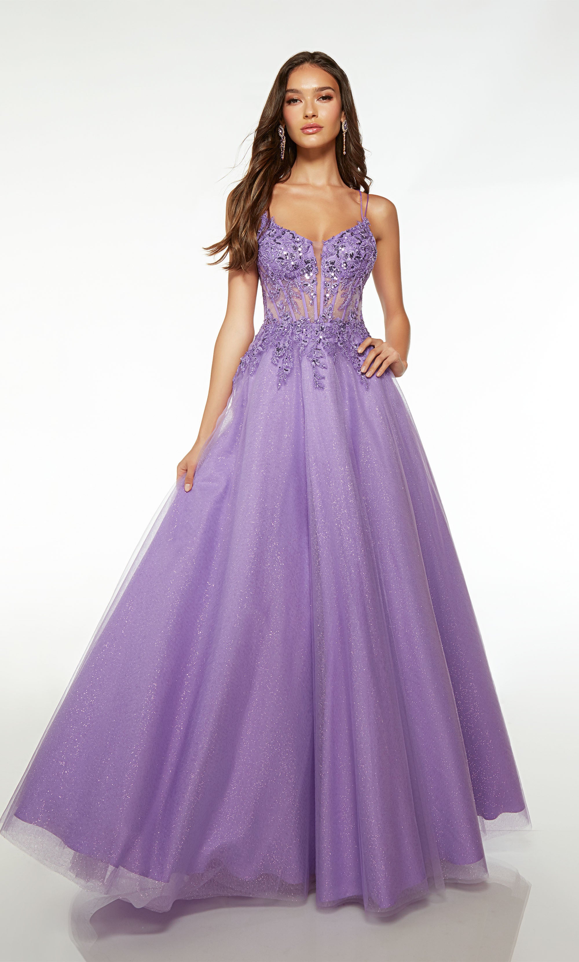 Pretty glitter tulle purple ball gown with an sheer corset bodice, sequined floral lace appliques, dual spaghetti straps, crisscross lace-up back, and an slight train.