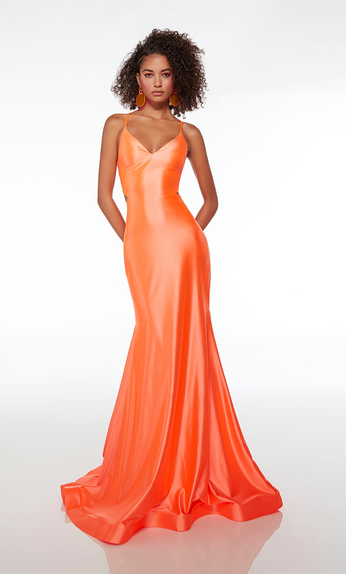 Bodycon orange prom dress in an mermaid silhouette, V neckline, side cutouts, lace-up back, ruching detail, and an long glamorous train.