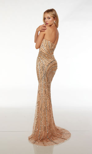 Alluring tan strapless formal gown adorned with gold and silver sequin detailing, featuring an zipper back enclosure and an slight train for an touch of elegance.
