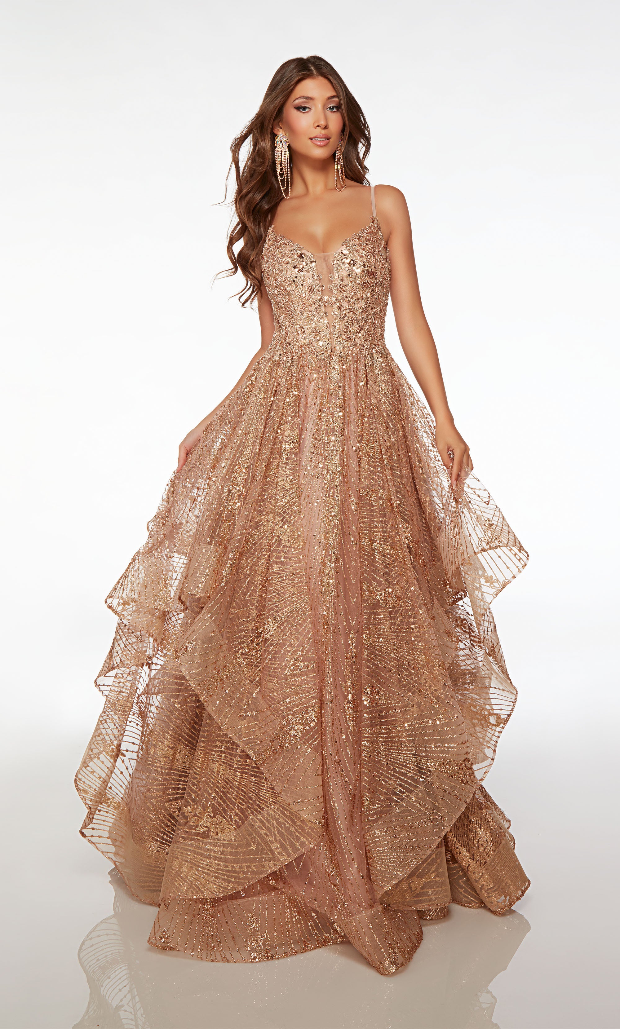 Rose gold glitter tulle ball gown with an plunging neckline, beaded lace bodice, adjustable straps, ruffled skirt, and an slight train for an glamorous look.