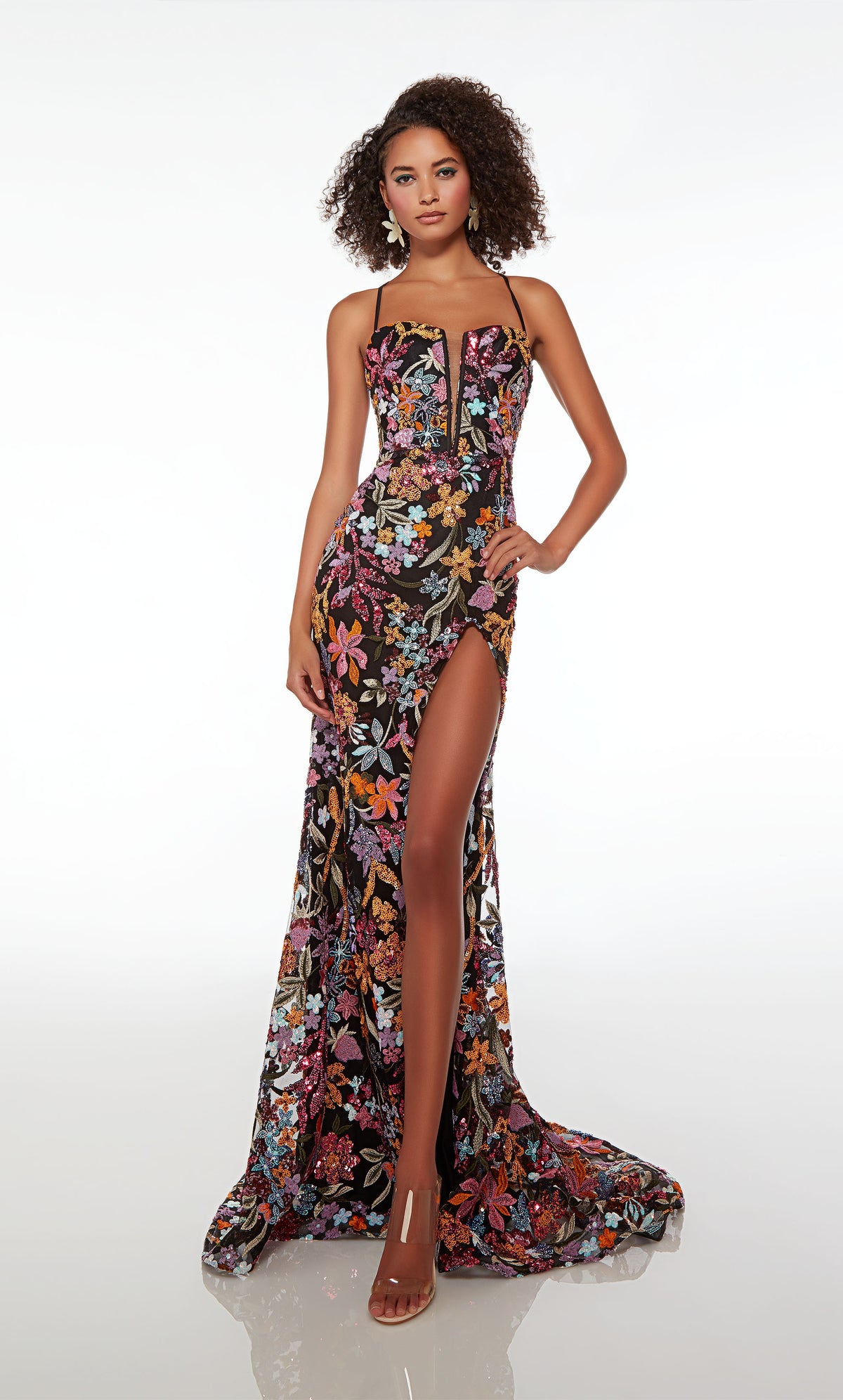 Black fitted formal dress adorned with colorful sequined flowers, featuring an plunging neckline, high side slit, crisscross lace-up back, and an train.