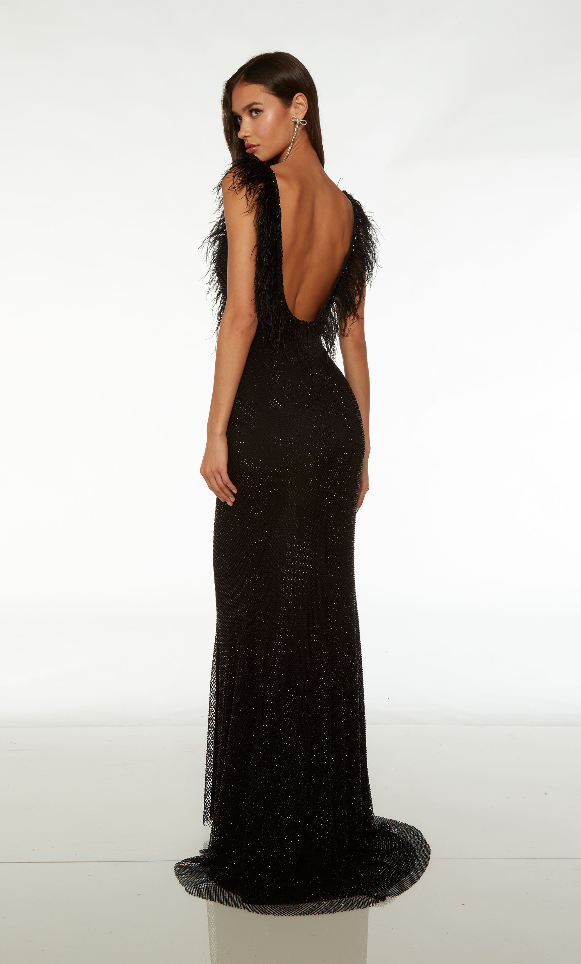 Chic black hotfix formal dress with plunging neckline, low back, train, and exquisite bead and feather trim for added elegance.