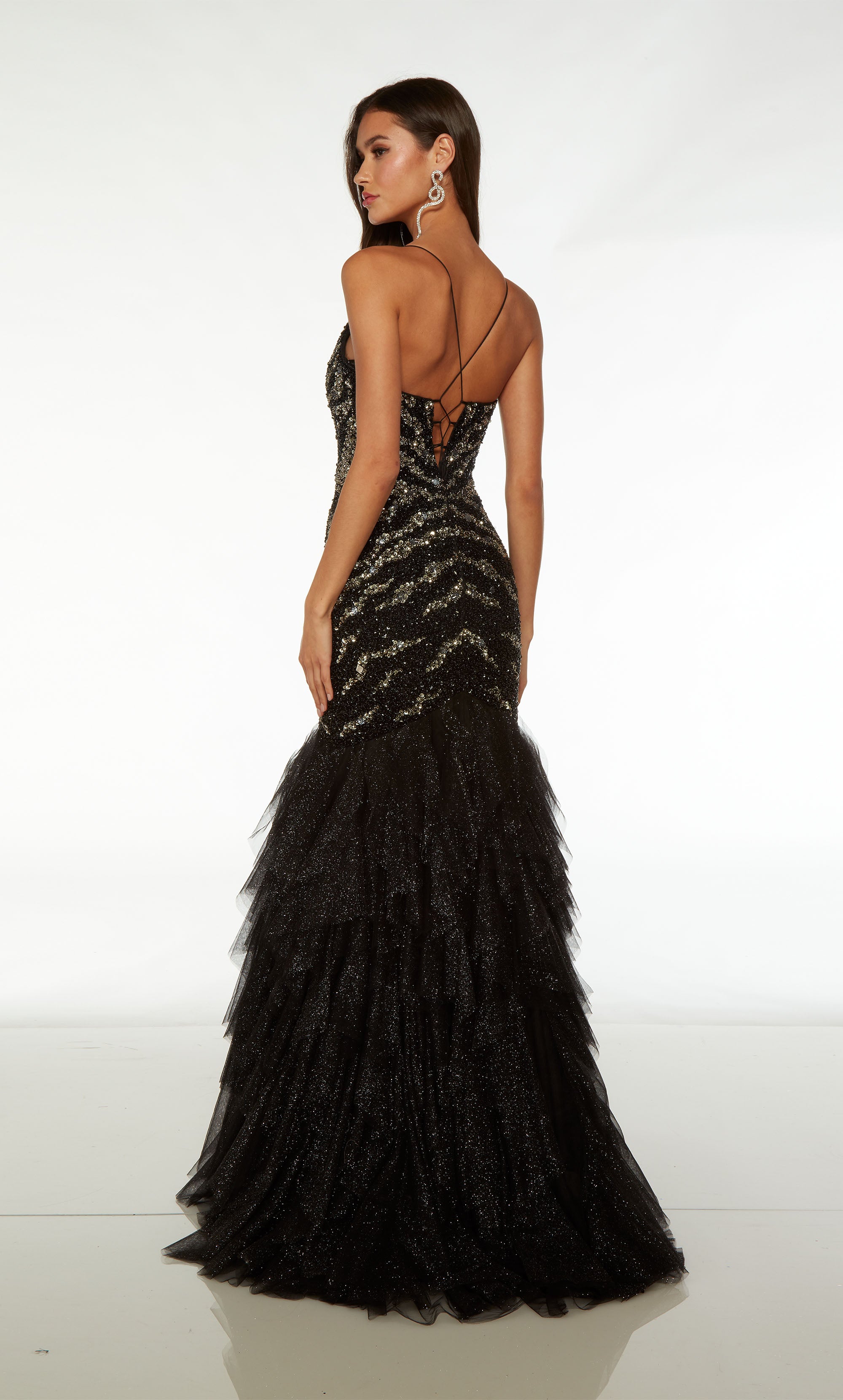Black and silver hand-beaded mermaid dress: plunging neckline, spaghetti straps, crisscross lace-up back, and ruffle detail on the skirt.
