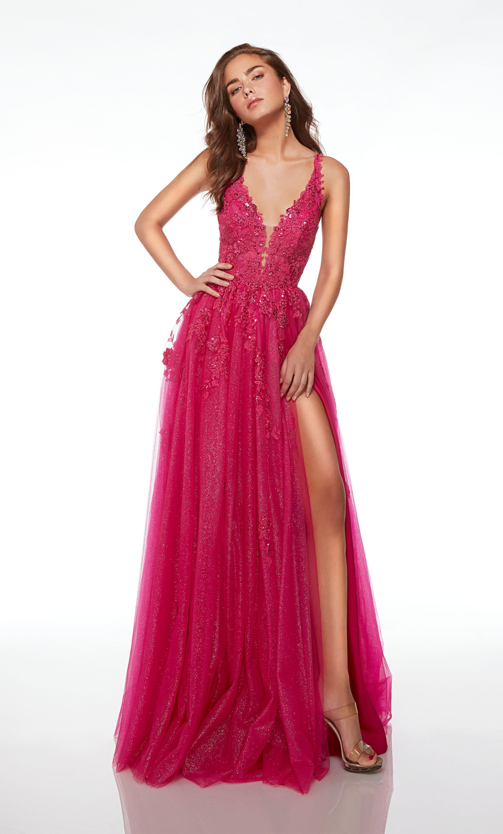Whimsical pink prom dress: plunging neckline, high side slit, train, floral lace, and glitter tulle fabric for an charming boho chic vibe.