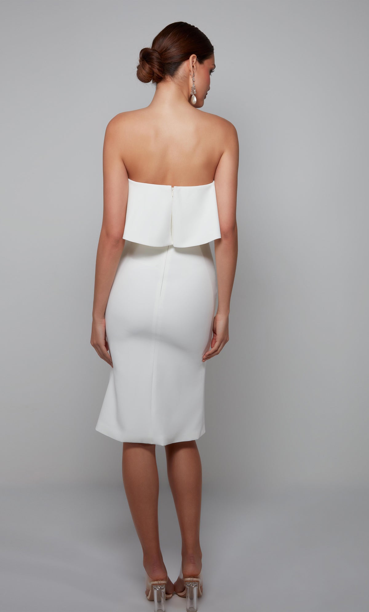 Women&#39;s ruffled strapless tube top dress with a zip up back in ivory.