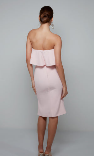 Women's ruffled strapless tube top dress with a zip up back in light pink.