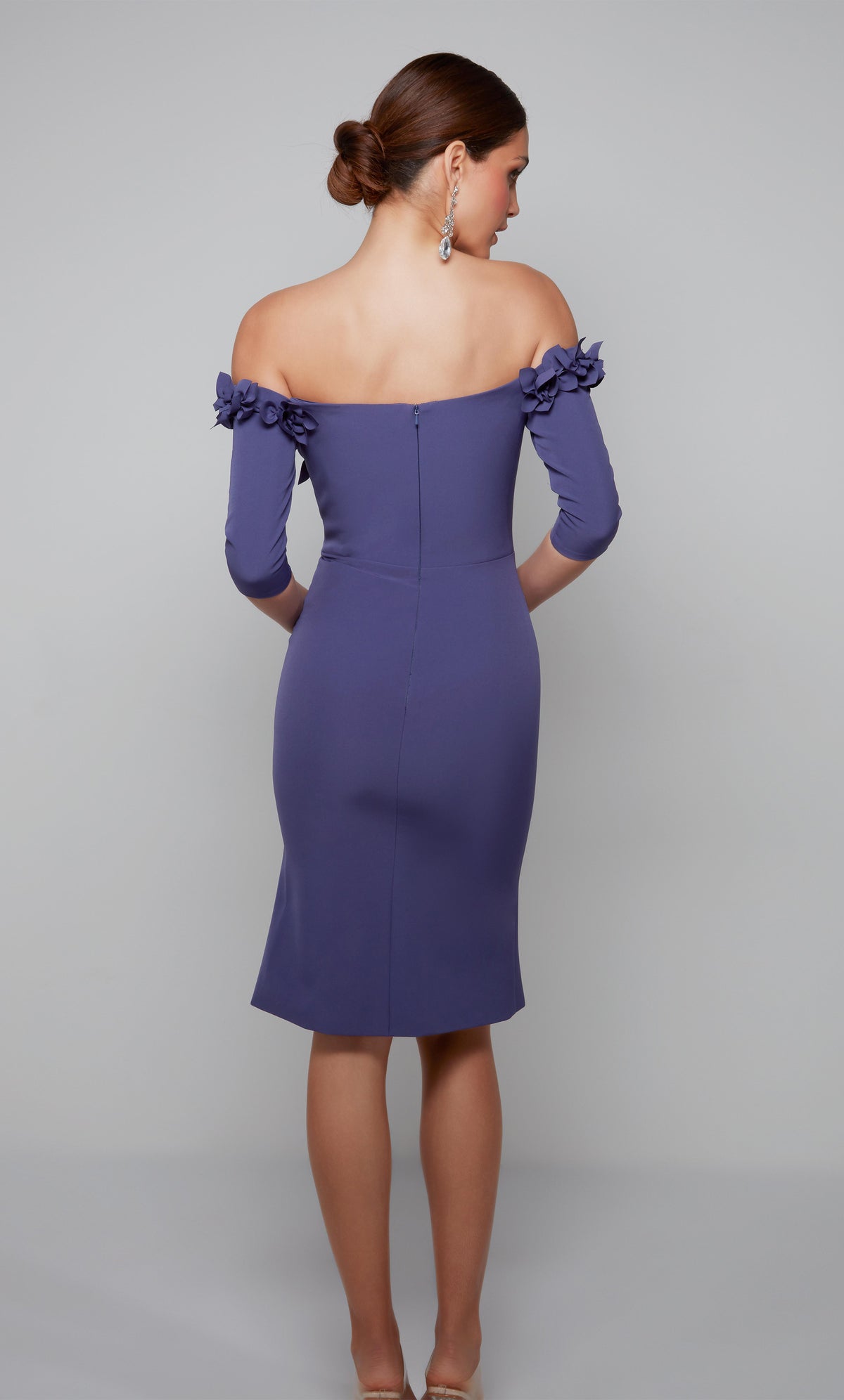 Purple cocktail midi dress with an off the shoulder bodice enhanced with an airy flower volant.
