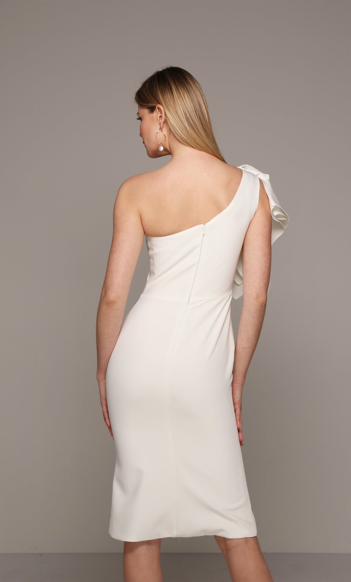Chic one shoulder ruffle engagement dress with a zip up back in ivory.