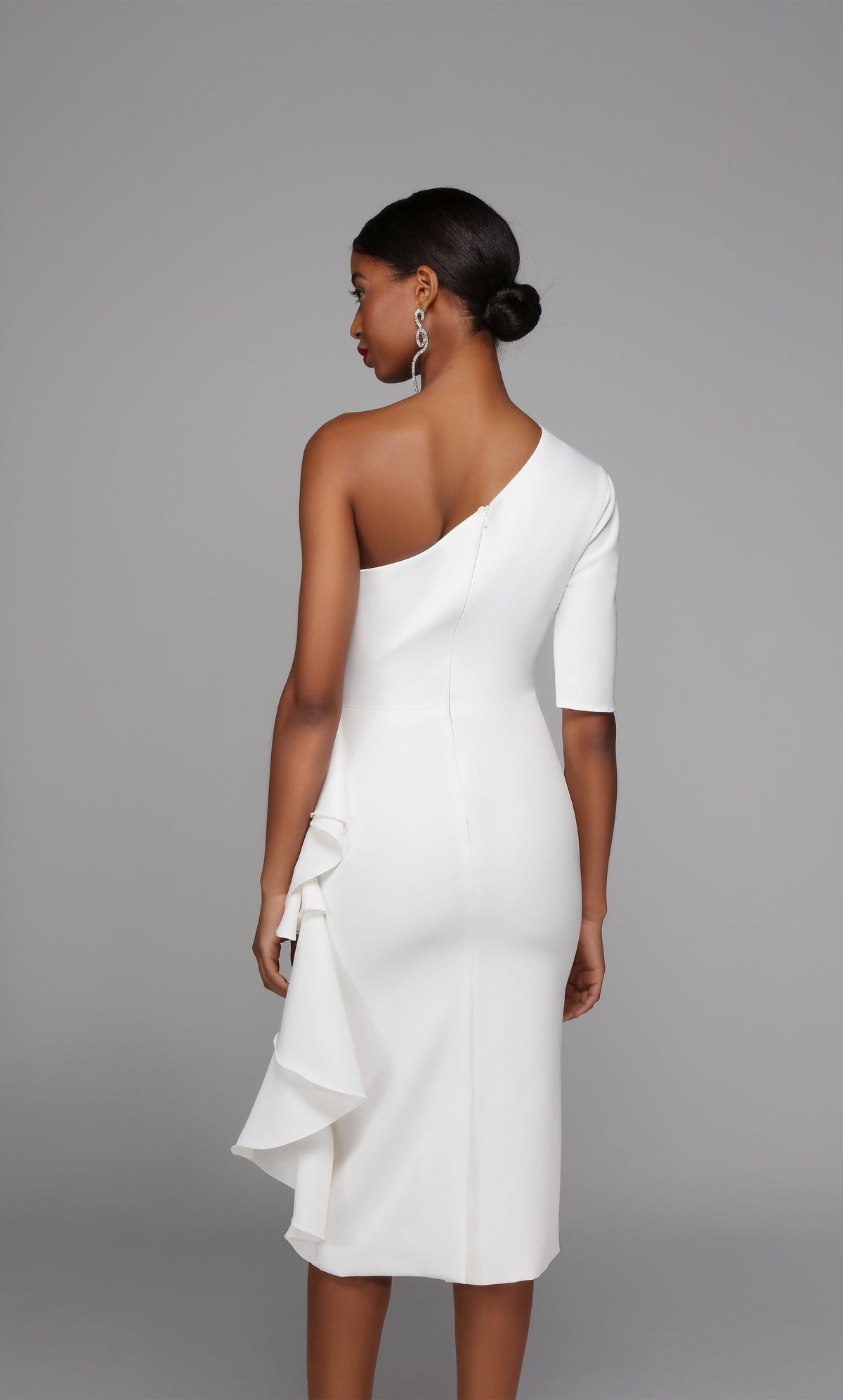 One shoulder white engagement party dress with a zip up back, back slit, and side ruffle.