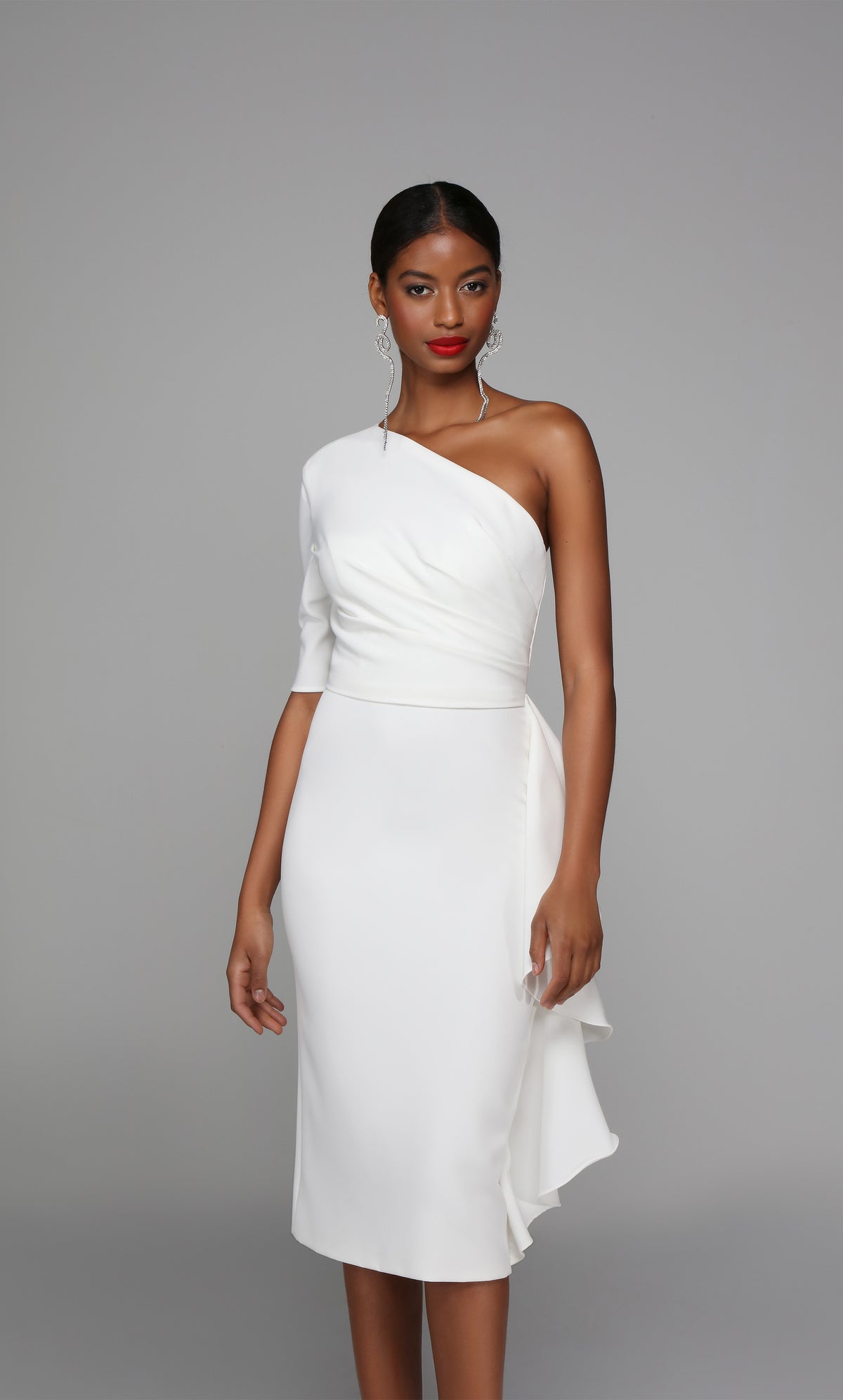 One shoulder ruffle dress with a ruched bodice in ivory.