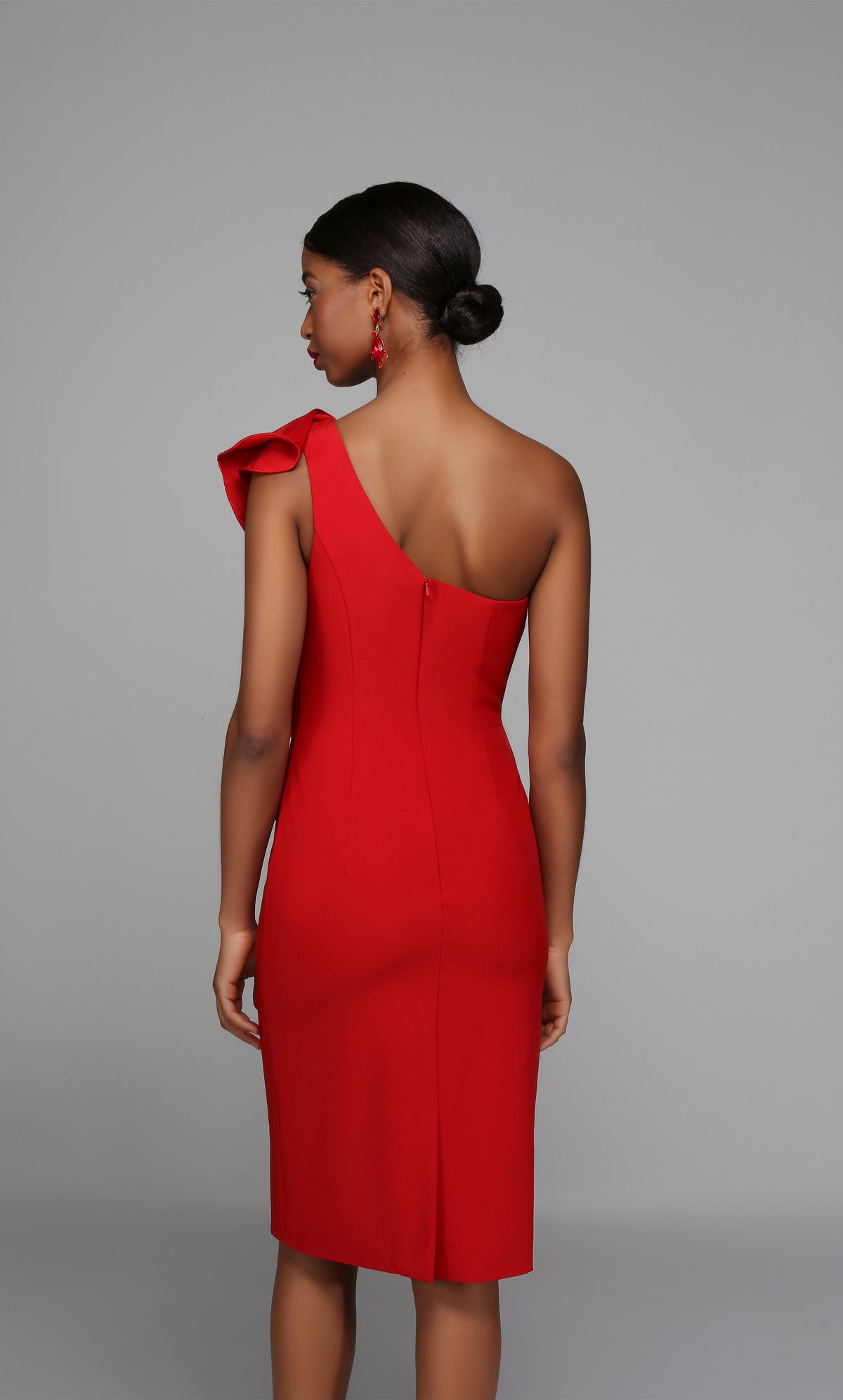 Red one shoulder cocktail dress enhanced with a zip up back and back slit.