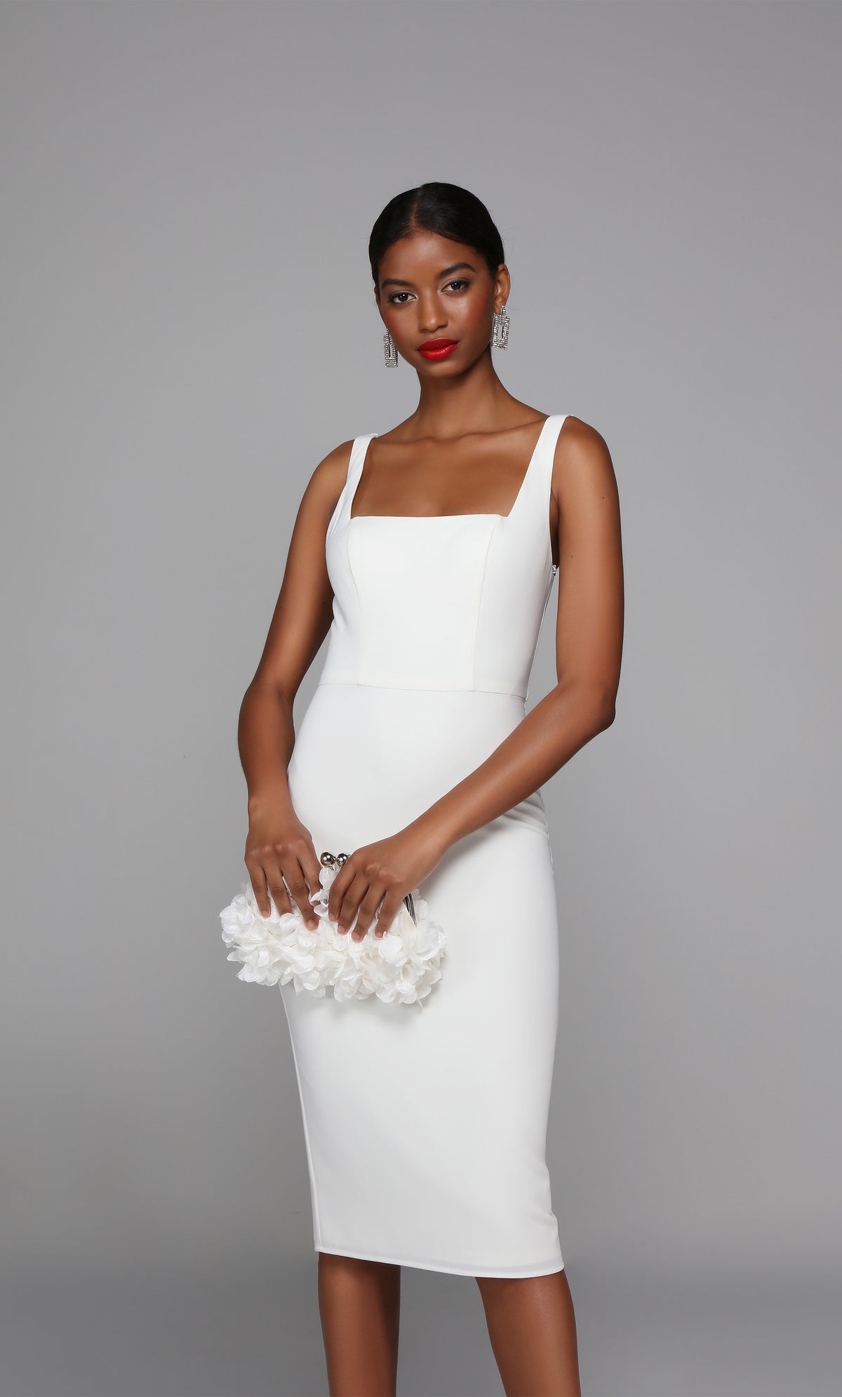 Sleeveless white midi dress with a square neckline.