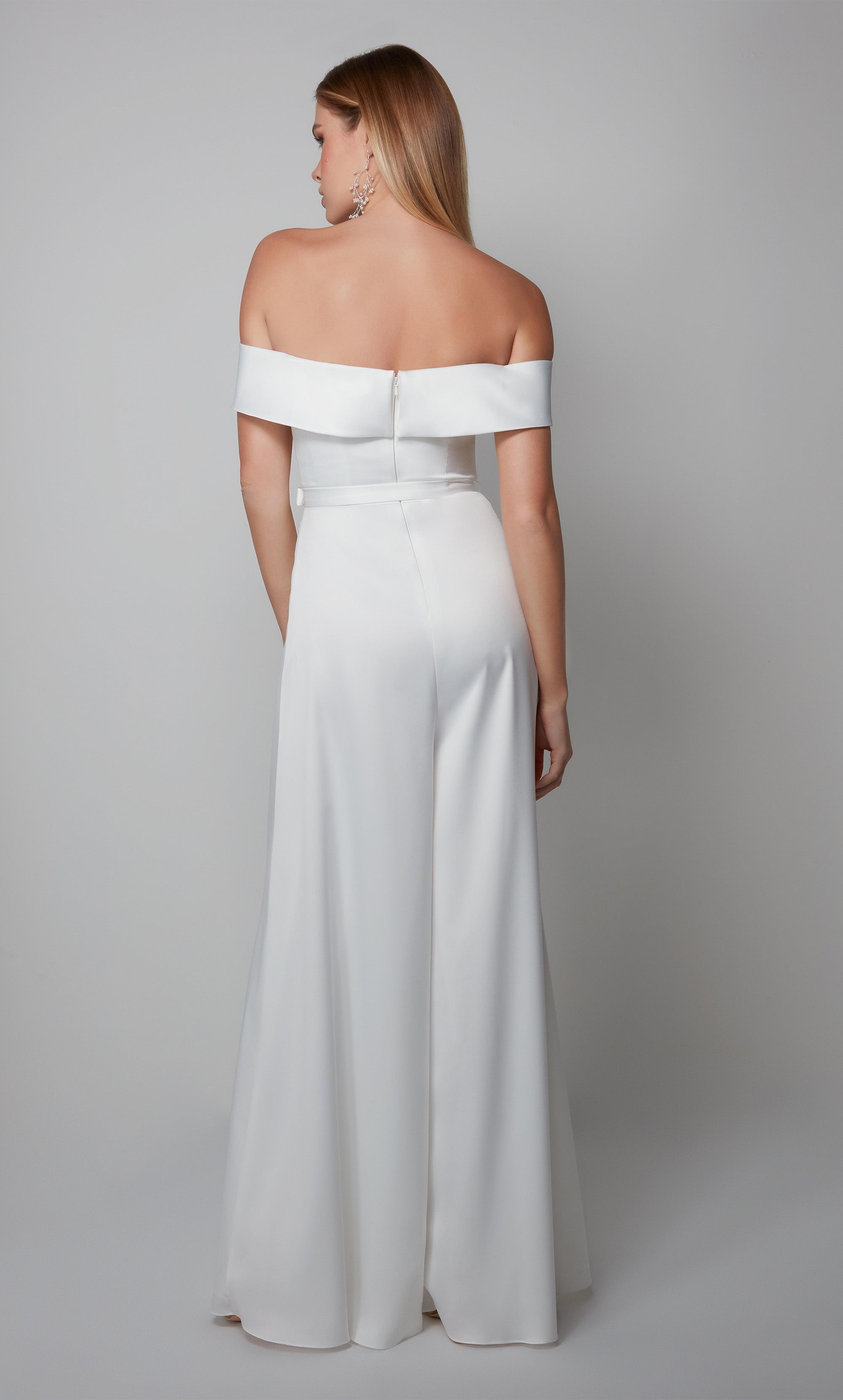 White engagement jumpsuit with an elegant off the shoulder neckline and matching belt at the natural waist. Color-SWATCH_70012__DIAMOND-WHITE