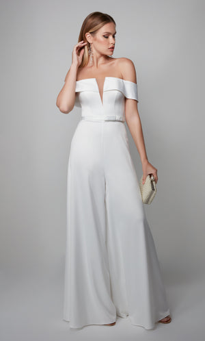 White formal jumpsuit with an elegant off the shoulder neckline and matching belt at the natural waist.