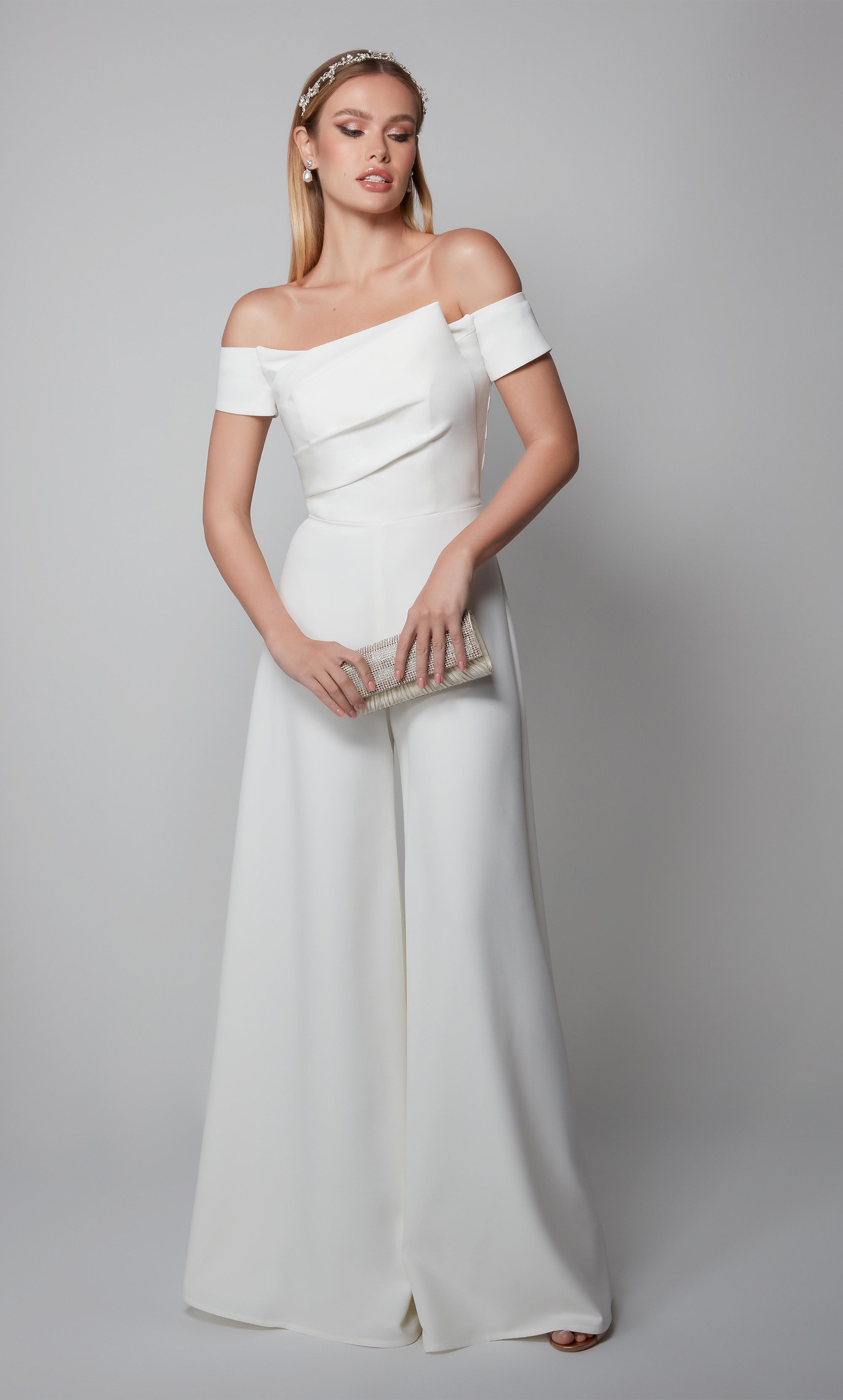Ivory wedding jumpsuit with an elegant off the shoulder pleated bodice. Color-SWATCH_70014__IVORY
