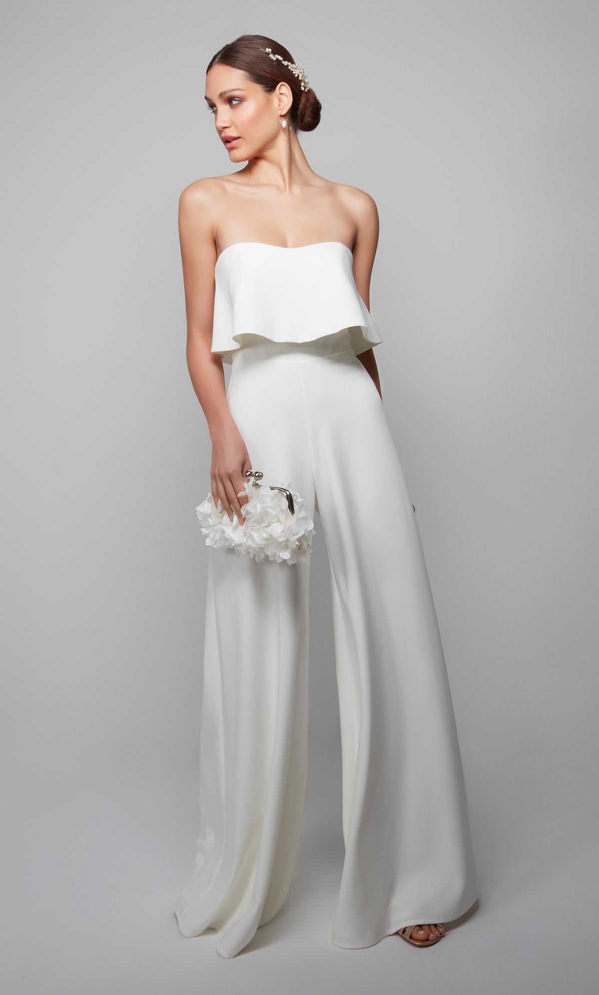 Ivory formal jumpsuit with elegant strapless ruffled bodice. 
