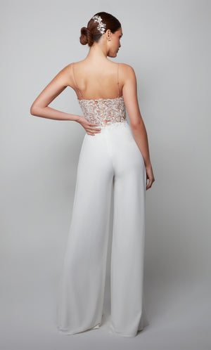 Ivory lace wedding jumpsuit with a sheer closed back with adjustable spaghetti straps.