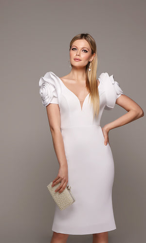 White midi dress with rose shaped sleeves and a plunging neckline.