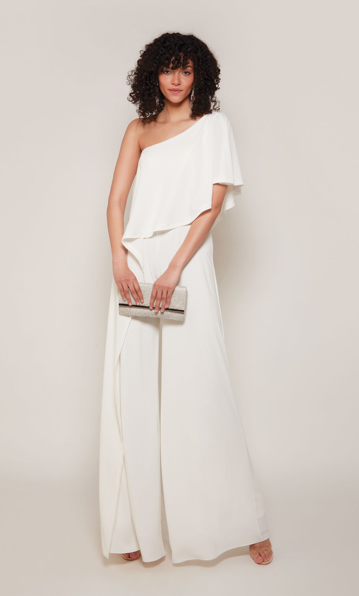 A chic, wide leg jumpsuit with a draped top in ivory.