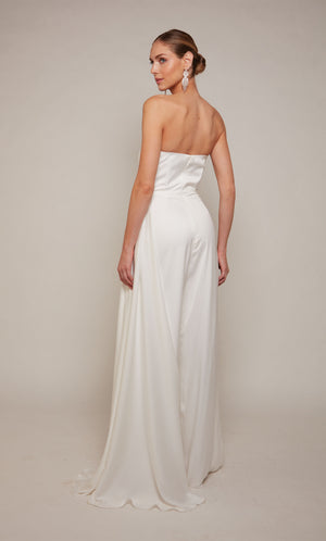 A chic white wedding jumpsuit with a ruched top and cascading drape, and wide leg pant.