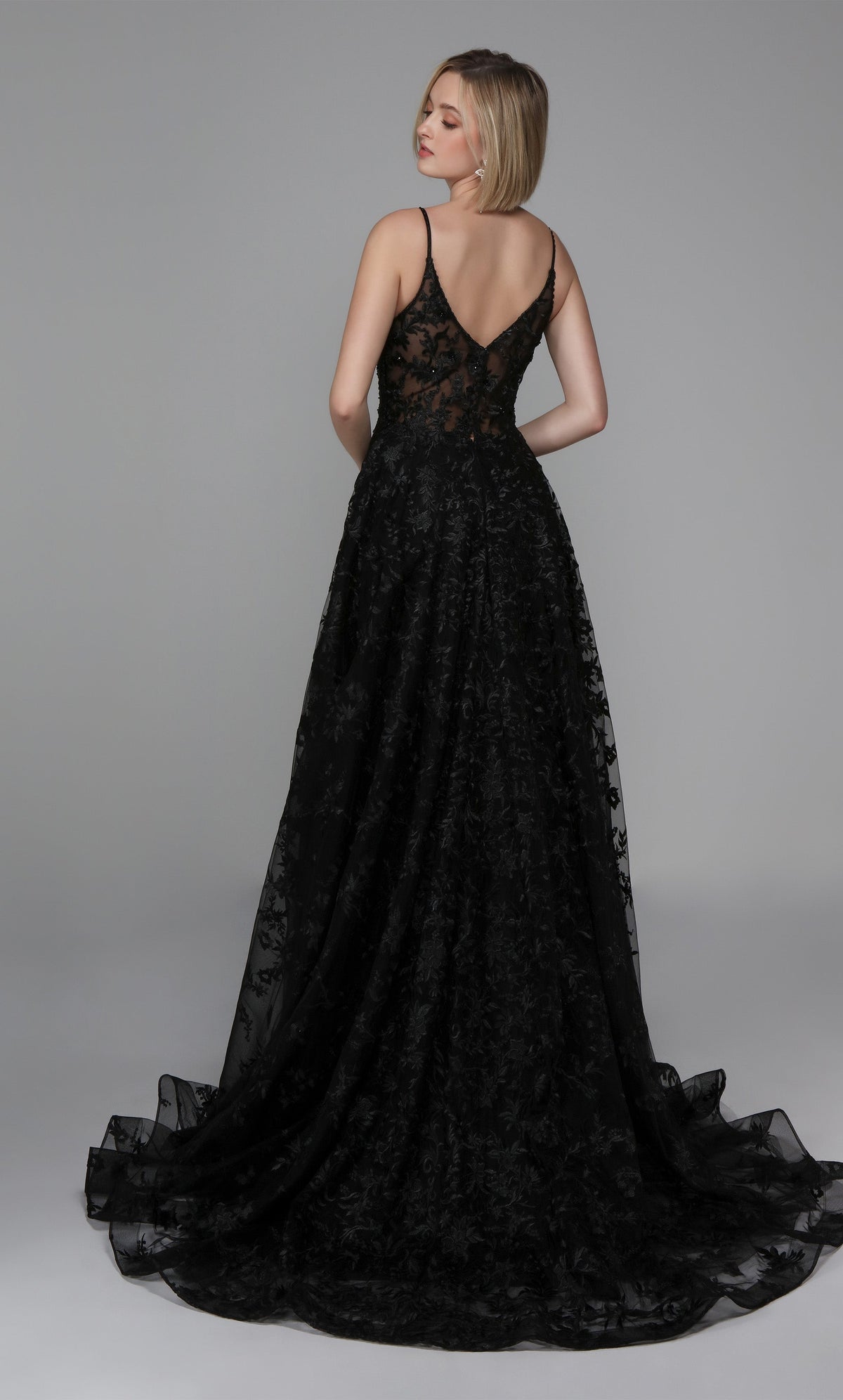 Floral lace black wedding dress with a sheer V back, satin buttons, and train.