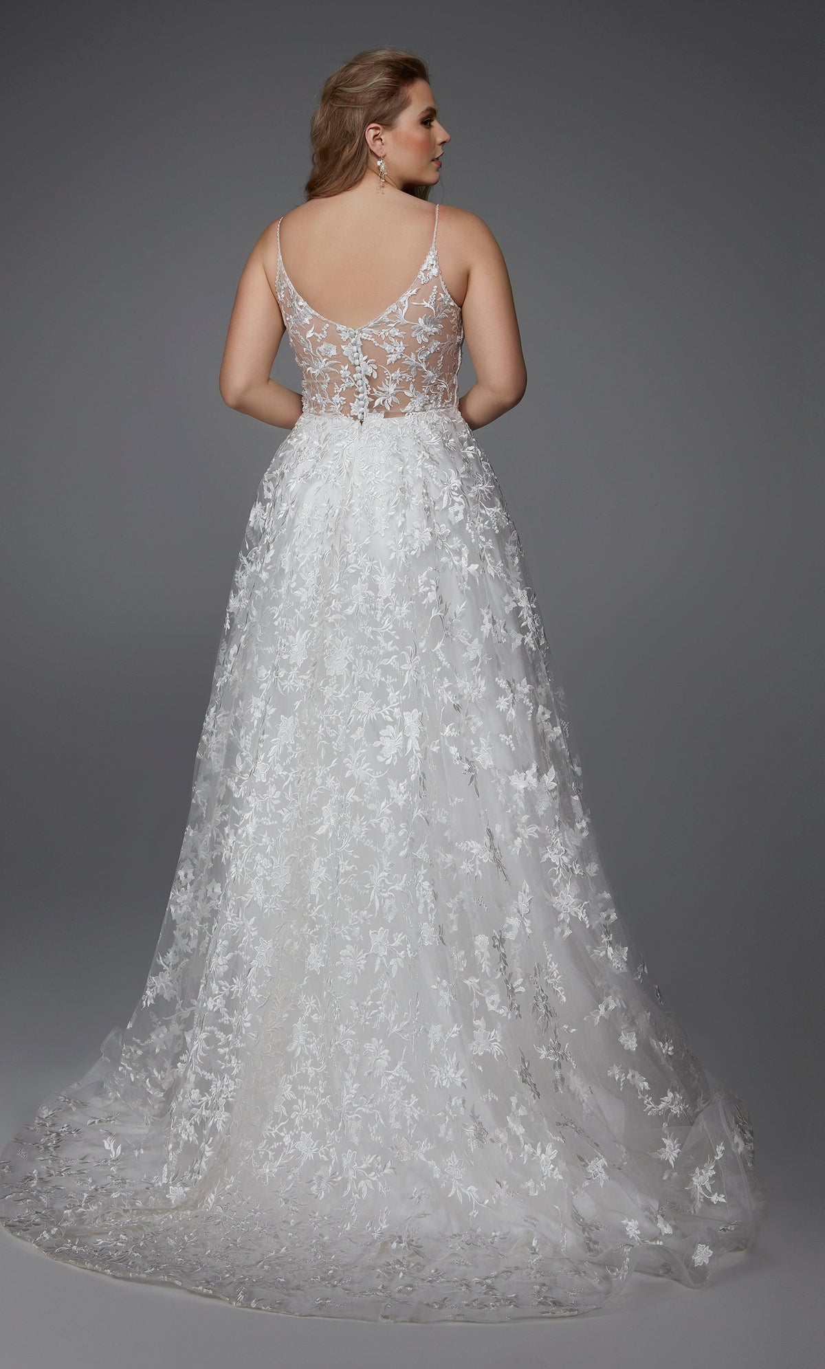A line Ivory lace wedding gown with a sheer V back, satin buttons, and train
