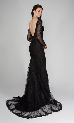 Black long sleeve wedding dress with a low V back, and decorative buttons on the back.