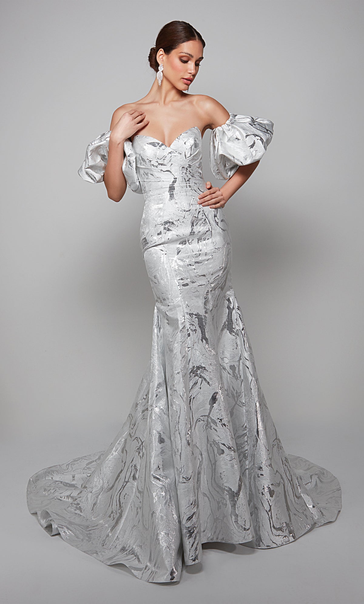 Fit and flare jacquard wedding gown with a strapless neckline and detachable puff sleeves in ivory-silver.