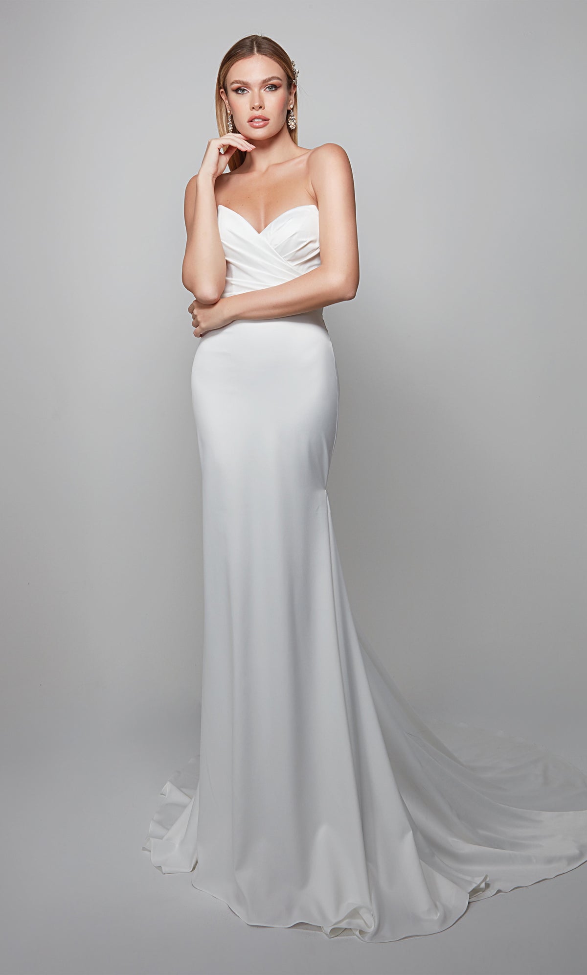 Strapless chic wedding dress with pleated bodice in white.