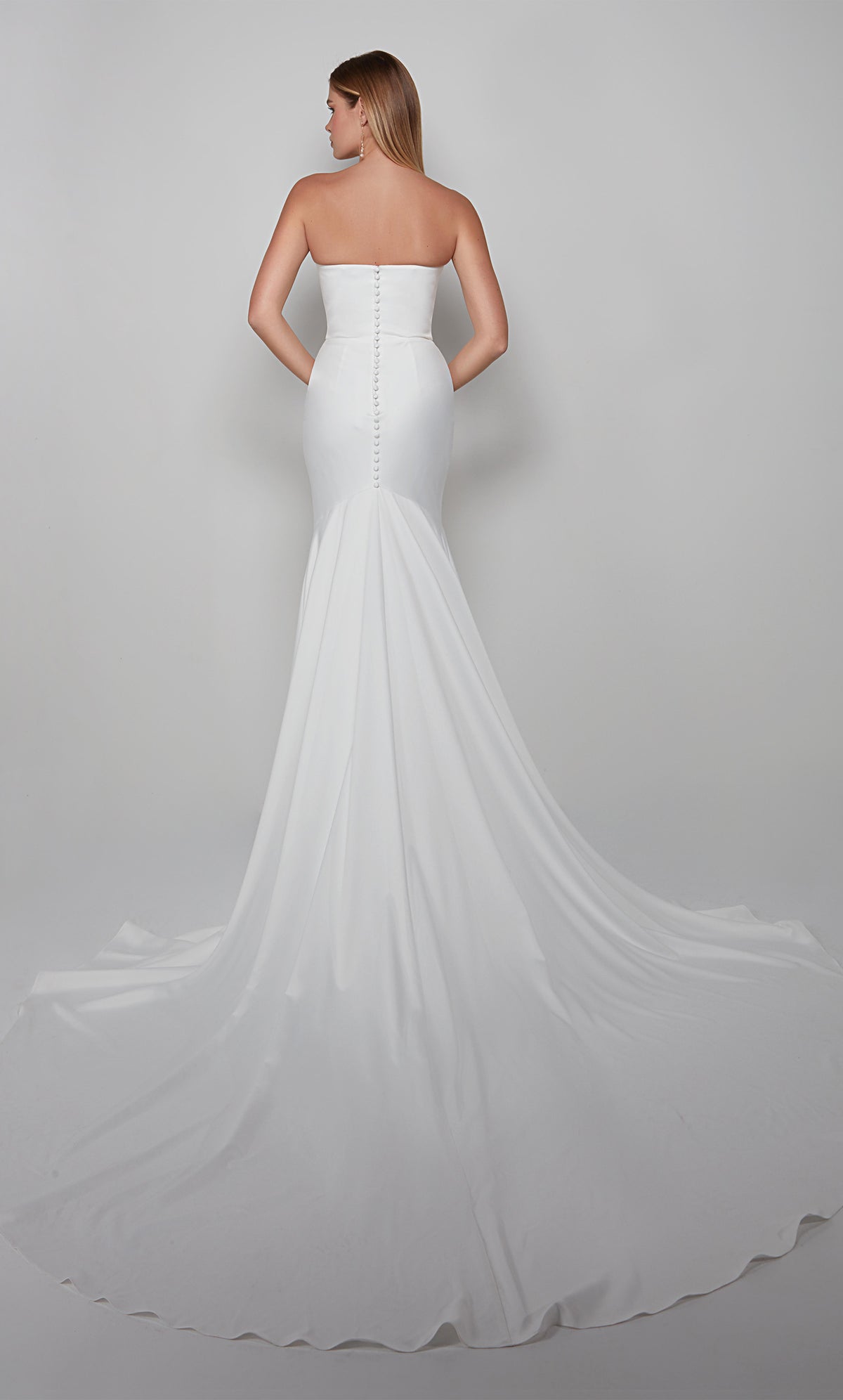 Strapless satin wedding dress with matching satin covered button closed back and train to complete the look.