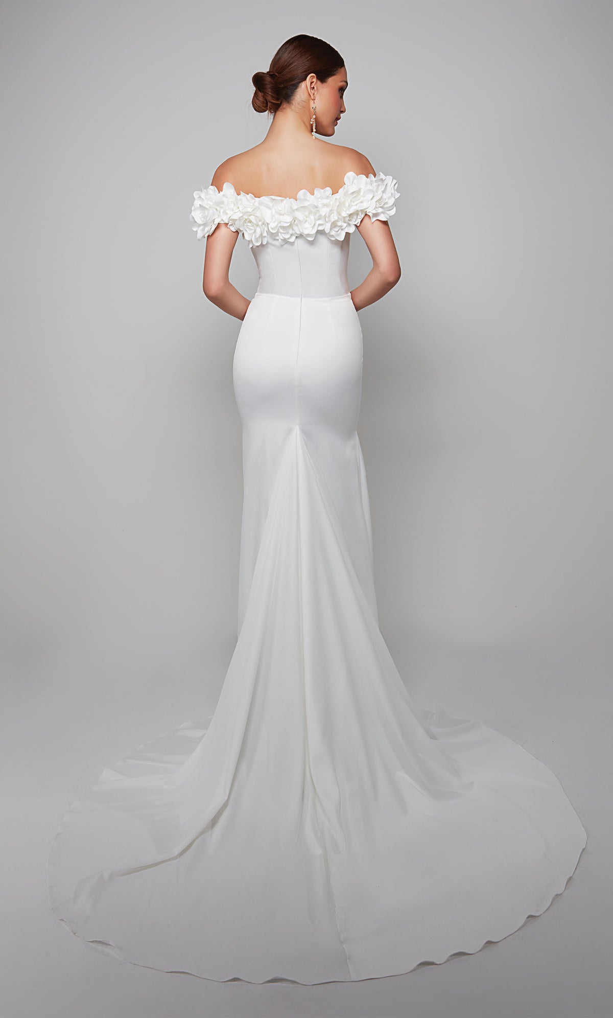 Fit and flare wedding dress featuring an off the shoulder bodice enhanced with a beautiful satin flower voiant and train.