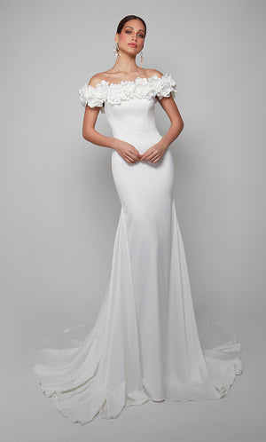 Fit and flare wedding dress featuring an off the shoulder bodice enhanced with a beautiful satin flower voiant.