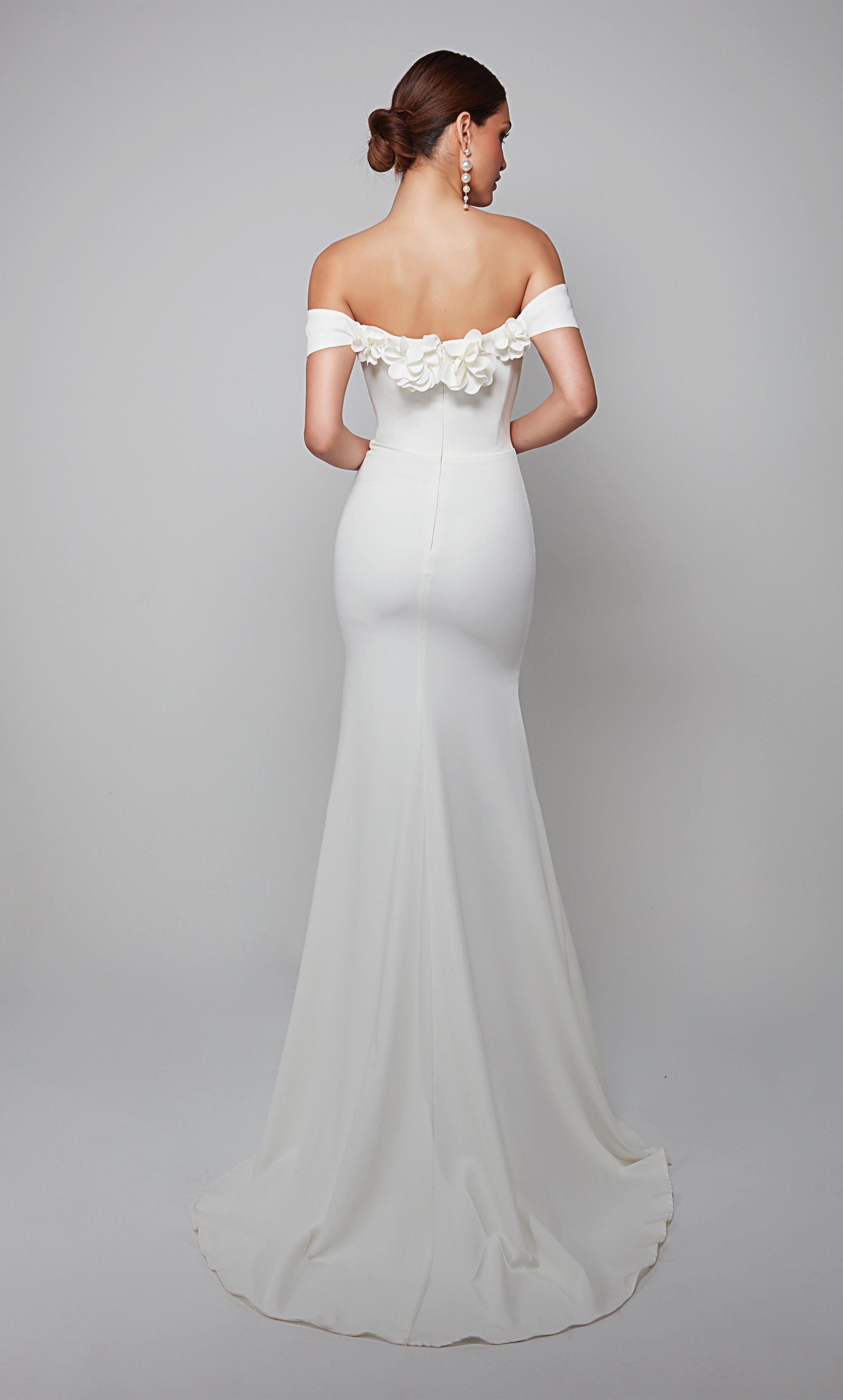 White fit and flare wedding dress featuring an off the shoulder bodice enhanced with a beautiful flower volant. Color-SWATCH_7062__DIAMOND-WHITE
