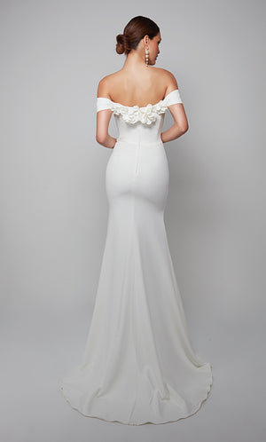 White fit and flare wedding dress featuring an off the shoulder bodice enhanced with a beautiful flower volant and train.