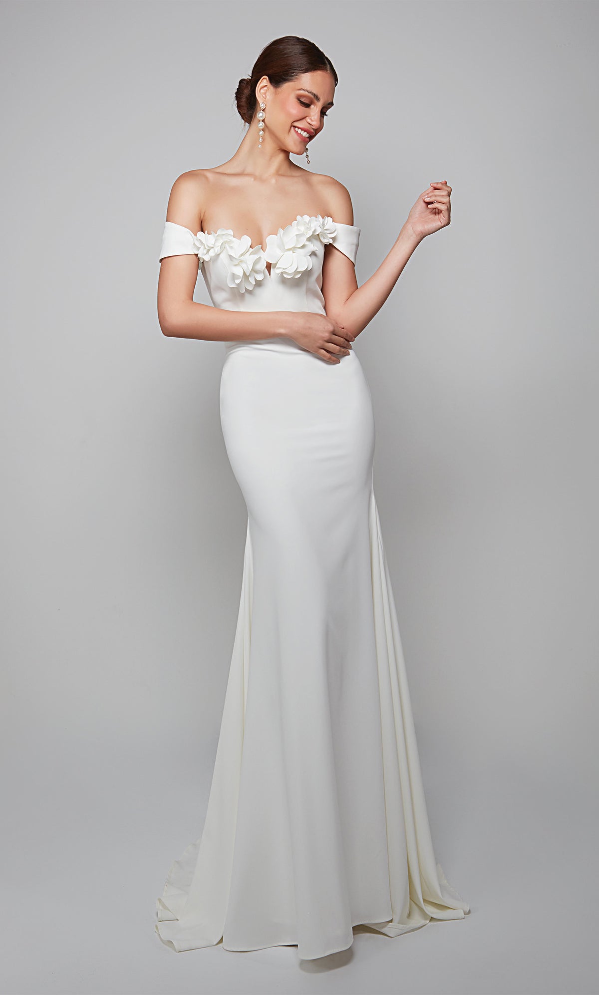 White fit and flare wedding dress featuring an off the shoulder bodice enhanced with a beautiful flower volant. Color-SWATCH_7062__DIAMOND-WHITE