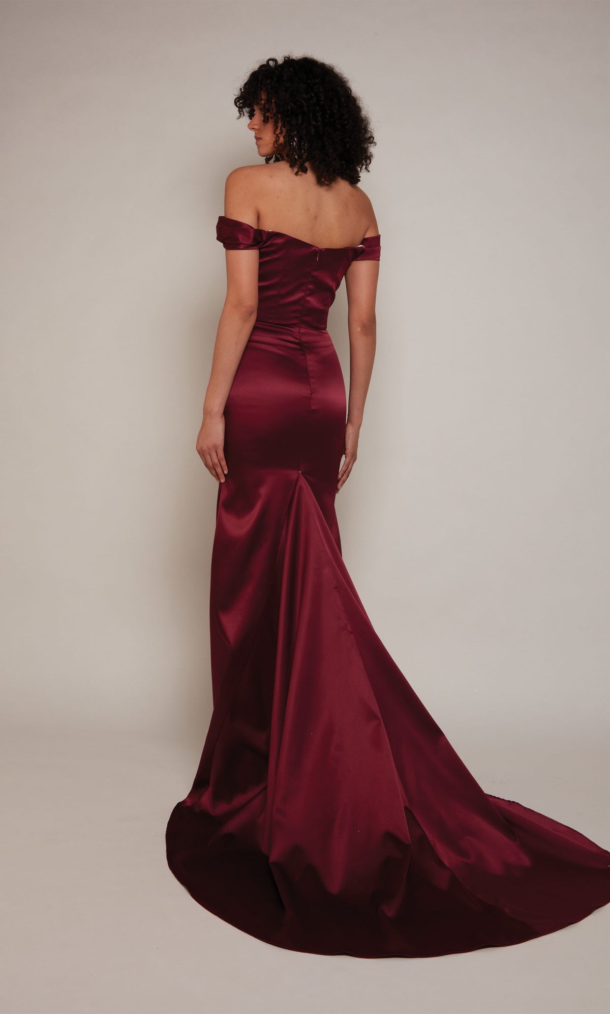 Simple wedding dress with an off the shoulder neckline, zip up back closure, and train in burgundy.