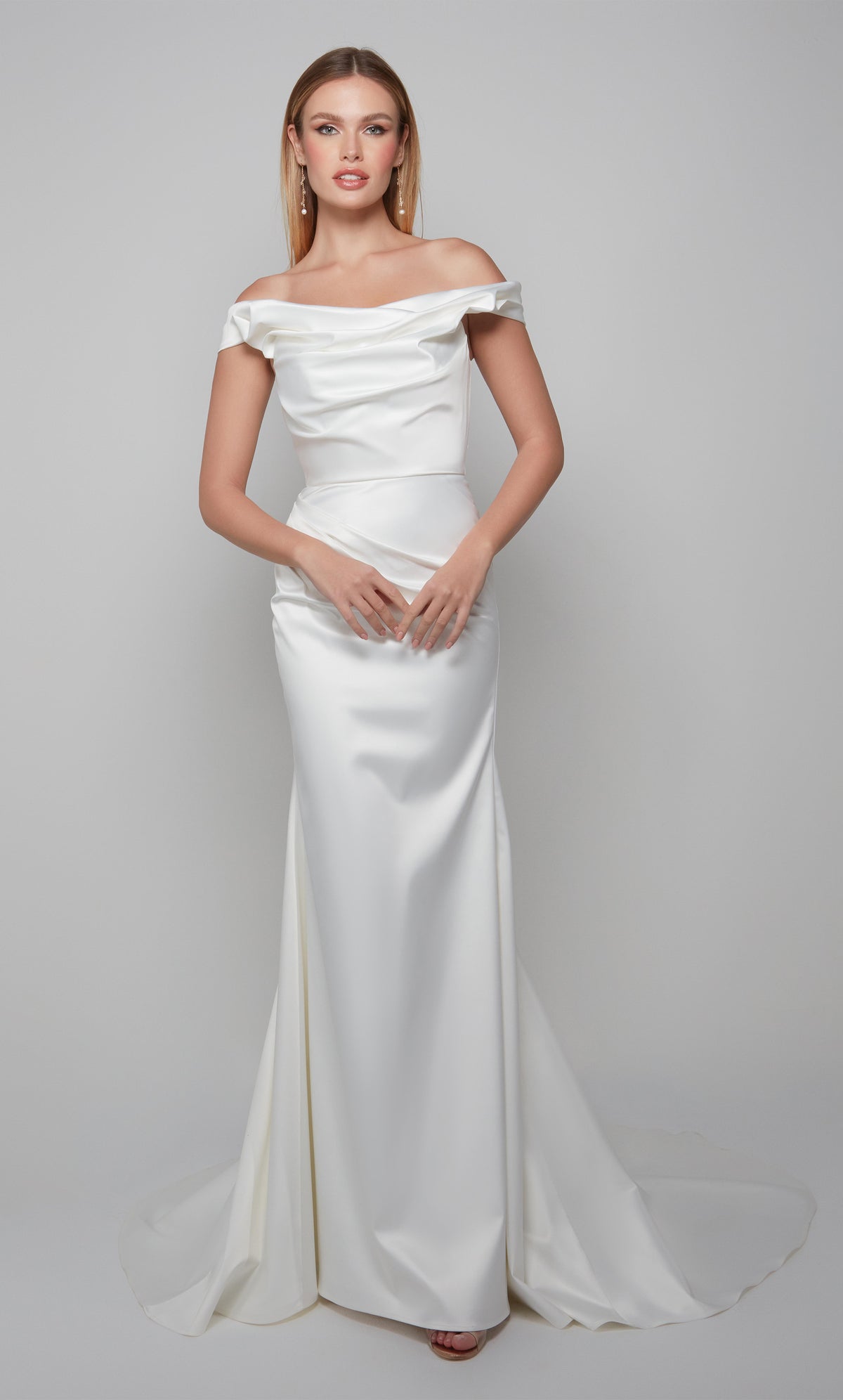Simple wedding dress with an off the shoulder neckline in ivory.