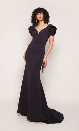 Midnight blue fit and flare scuba formal gown with rosette sleeves, an plunging neckline, and an fit and flare silhouette.