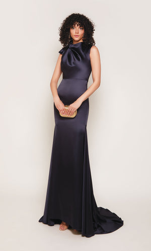 Midnight blue duchess satin gown with an high neckline and fit and flare silhouette.