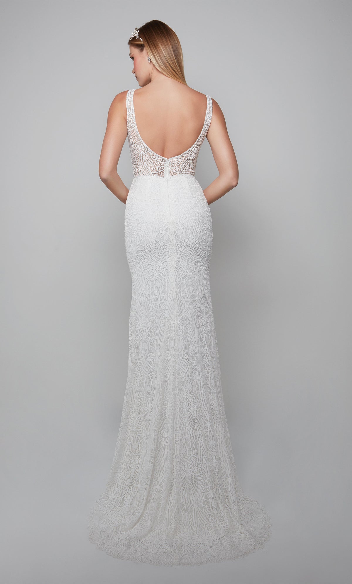 Boho chic wedding gown with a scooped open back and train in ivory.