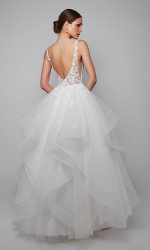 Deep V back wedding dress with a sheer floral lace bodice and tiered skirt with floral lace appliques in ivory.