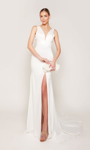A white, satin wedding gown with an illusion deep V-neckline and elegant side slit.