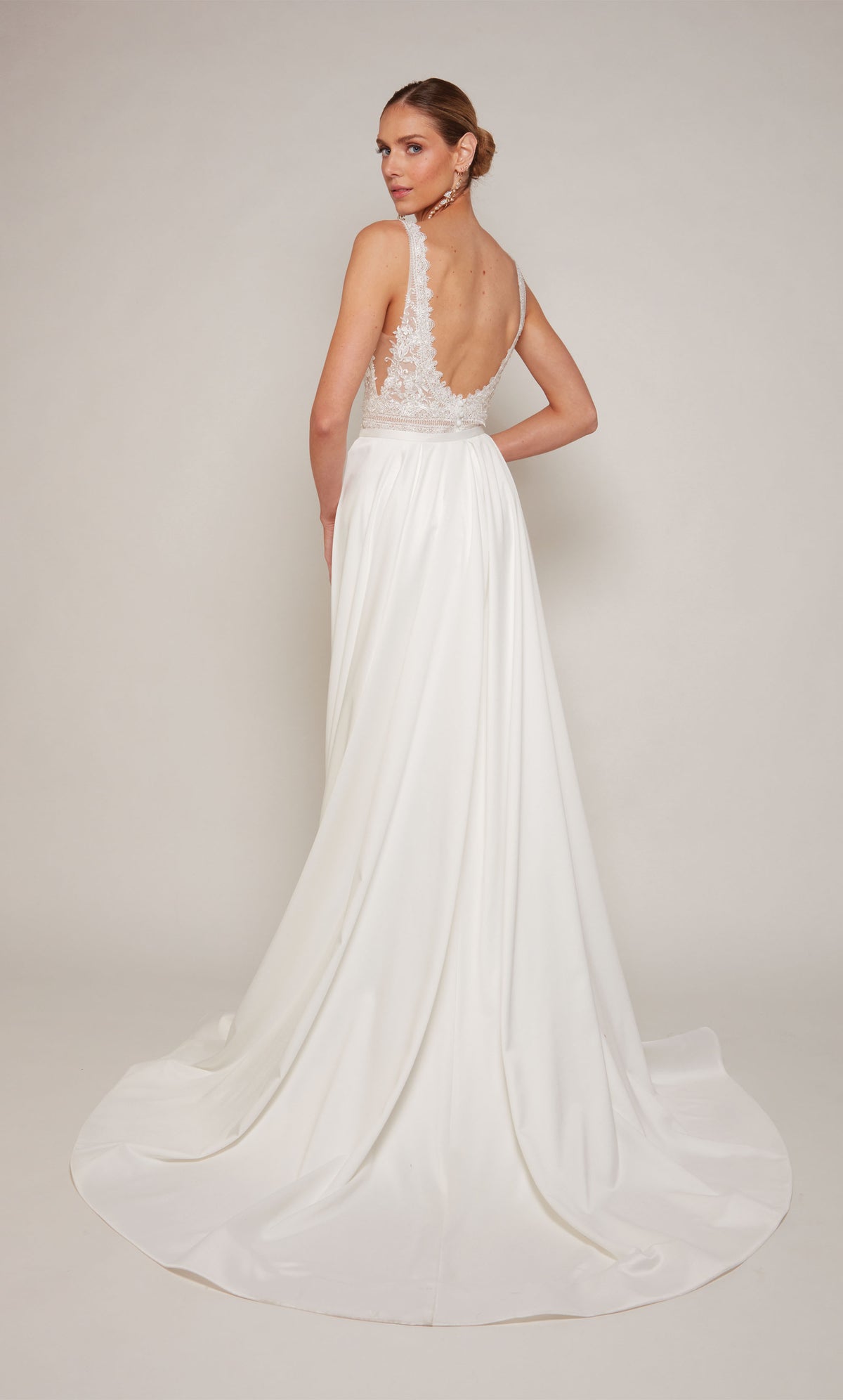 Luxurious satin sheath wedding dress in white, spotlighting an elegant U-shaped open back and delicate lace details. The dress comes with a detachable train that adds a hint of drama and formality during the ceremony, and can be detached for a more understated reception style.