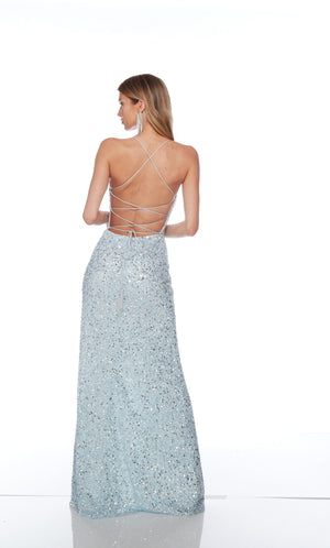 Blue sequin gown with scooped neckline, slit, and strappy lace-up back for an elegant and alluring look.